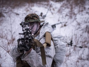 A U.S. soldier poses for photographers during a joint annual winter exercise in Pyeongchang, some 180 kilometres east of Seoul, on January 28, 2016.