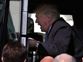 U.S. President Donald Trump sits in the cab of a truck as he welcomes members of American Trucking Associations to the White House March 23, 2017 in Washington, DC.