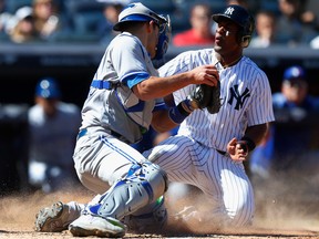 In this April 21 file photo, New York Yankees third baseman Miguel Andujar scores a run against the Toronto Blue Jays.