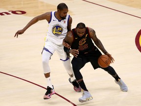 LeBron James of the Cleveland Cavaliers drives to the basket defended by Kevin Durant of the Golden State Warriors in the second half during Game 3 of the 2018 NBA Finals at Quicken Loans Arena on Wednesday in Cleveland.