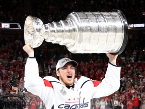 Washington Capitals forward T.J. Oshie skates with the Stanley Cup on June 7.