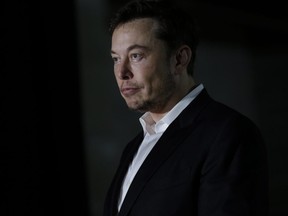 Engineer and tech entrepreneur Elon Musk of The Boring Company listens as Chicago Mayor Rahm Emanuel talks about constructing a high speed transit tunnel at Block 37 during a news conference on June 14, 2018 in Chicago, Illinois.