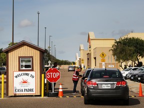 A security guard checks cars at the entrance to Casa Padre, a former Walmart which is now a center for unaccompanied immigrant children on June 24, 2018 in Brownsville, Texas.