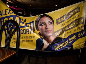 A banner for progressive challenger Alexandria Ocasio-Cortez hangs across chairs at her victory party in the Bronx after an upset against incumbent Democratic Representative Joseph Crowly on June 26, 2018 in New York City.