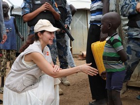 Actress Ashley Judd meets a refugee boy in Juba, South Sudan, Thursday, June 28, 2018. In her first visit to civil war-torn South Sudan, Ashley Judd had a message for survivors of sexual assault in a country where rape is a widespread weapon. "I see you, I love you and I'm here for you," she said in an interview with The Associated Press.