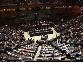 Italian premier Giuseppe Conte (C) speaks at the Lower House, ahead of a confidence vote on the government program, in Rome on June 6, 2018.