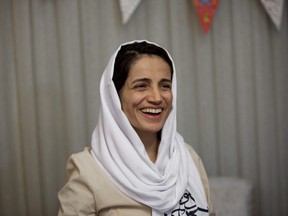 In this file photo taken on September 18, 2013 Iranian lawyer Nasrin Sotoudeh smiles at her home in Tehran after being freed following three years in prison.