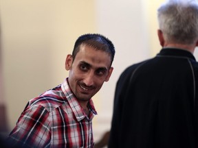 Main defendant Samsoor Lahoo smiles during the trial of human traffickers over the gruesome deaths of 71 migrants who suffocated in a lorry in 2015, on June 14, 2018 in Kecskemet, Hungary.