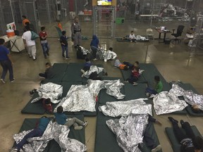 In this file U.S. Customs and Border Protection photo dated June 17, 2018 and obtained June 18, 2018 shows intake of illegal border crossers by US Border Patrol agents at the Central Processing Center in McAllen, Texas.