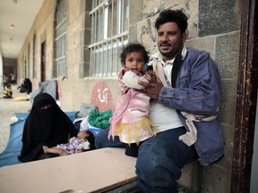 A displaced Yemeni family, who fled their home by the fighting the port city of Hodeida, sit in a school allocated for IDPs in Sanaa, Yemen, Saturday, Jun. 23, 2018.  Last week, the Saudi-led coalition backing Yemen's internationally recognized government launched an offensive to retake rebel-held Hodeida. Fighting has been raging especially at and around the city's airport, threatening to worsen Yemen's humanitarian situation.