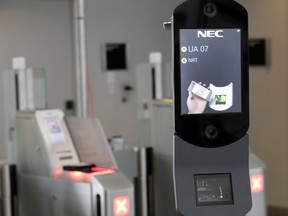 In this July 12, 2017 file photo, a U.S. Customs and Border Protection facial recognition device is ready to scan another passenger at a United Airlines gate at George Bush Intercontinental Airport, in Houston.