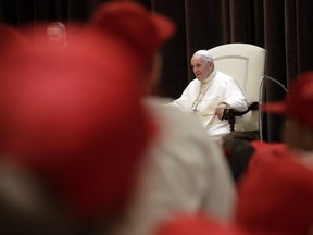 Pope Francis meets a group of children who traveled on a special train from Milan and arrived at St. Peter's station at the Vatican, Saturday, June 9, 2018 as part of an initiative to give children living in disadvantaged areas of the country a day of joy.