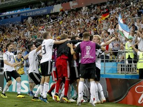 Germany players celebrate after winning 2-1 a group F match between Germany and Sweden at the 2018 soccer World Cup in the Fisht Stadium in Sochi, Russia, Saturday, June 23, 2018.