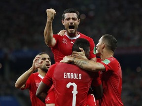 Switzerland's Blerim Dzemaili, top celebrates after scoring his side's first goal during the group E match between Switzerland and Costa Rica, at the 2018 soccer World Cup in the Nizhny Novgorod Stadium in Nizhny Novgorod , Russia, Wednesday, June 27, 2018.