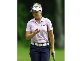 Brooke Henderson, of Canada, reacts after making a birdie putt on the sixth hole during the first round of the U.S. Women's Open golf tournament at Shoal Creek, Thursday, May 31, 2018, in Birmingham, Ala. Brooke withdrew from the tournament before the start of the second round for personal reasons. The LPGA tweeted Friday that the native of Smiths Falls, Ont., will be returning home to Ottawa to be with her family.