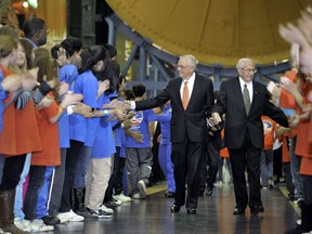 FILE - In this Thursday, Feb. 3, 2011 file photo, Neil Armstrong, left, and Dr. George von Tiesenhausen enter the Davidson Center walking past a group of space campers at the U.S. Space & Rocket Center in Huntsville, Ala. Armstrong, the first man to walk on the moon, presented the Lifetime Achievement Award for Education to Tiesenhausen. At 104, Tiesenhausen, the last of the German rocket team that launched the U.S. space program, died at his Huntsville residence Sunday night, June 3, 2018.