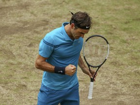 Switzerland's Roger Federer celebrates a point against Croatia's Borna Coric during the final match at the Gerry Weber Open ATP tennis tournament in Halle, Germany, Sunday, June 24, 2018.