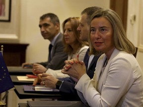 EU High Representative for Foreign Affairs and Security Policy Federica Mogherin, right, attends a meeting with Jordanian Foreign Minister Ayman Safadi in Amman, Jordan, Sunday, June10, 2018.