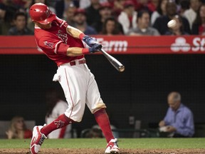 Los Angeles Angels' Ian Kinsler hits a two-run home run during the sixth inning of a baseball game against the Kansas City Royals in Anaheim, Calif., Wednesday, June 6, 2018.