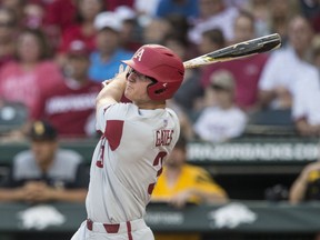 Arkansas' Jared Gates hits a two-run home run against Southern Mississippi during the second inning of an NCAA college baseball tournament regional game Saturday, June 2, 2018, in Fayetteville, N.C.