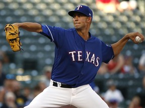 Texas Rangers starting pitcher Mike Minor delivers against the San Diego Padres during the first inning of a baseball game Wednesday, June 27, 2018, in Arlington, Texas.