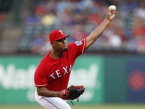 Texas Rangers starting pitcher Yohander Mendez delivers a pitch to a Colorado Rockies batter during the first inning of a baseball game Friday, June 15, 2018, in Arlington, Texas.