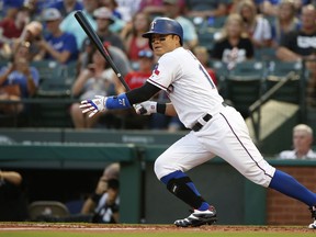 Texas Rangers right fielder Shin-Soo Choo (17) singles against the San Diego Padres during the third inning of a baseball game Monday, June 25, 2018, in Arlington, Texas.