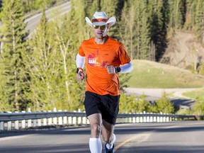 Dave Proctor runs in Sheep River Provincial Park, Alta. in this undated handout photo. Proctor will soon begin his quest to run to the Atlantic in record time.