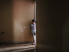 Batool Lababidi, a Syrian orphan from Aleppo, stands outside her room at an orphanage in Jarablus, northern Syria, Wednesday, May 30, 2018. Nearly 50 children orphaned by the Syrian war escaped the hell that was their hometown of Aleppo as government forces moved in under a hail of fire. In the year and half since, the children and their instructors o, have been uprooted twice more. It has finally landed a small house in the sleepy northern town of Jarablus, which was once a hub for Islamic State militants along the border with Turkey but has been governed by a Turkey-backed administration since 2016.