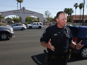 Scottsdale Police Department Sgt. Ben Hoster speaks to the media after local police surrounded a local hotel where a suspect wanted in four killings was staying Monday, June 4, 2018, in Scottsdale, Ariz. According to police, the suspect killed himself as police closed in on the hotel.