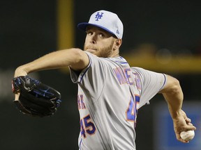 New York Mets pitcher Zack Wheeler throws in the first inning during a baseball game against the Arizona Diamondbacks, Sunday, June 17, 2018, in Phoenix.