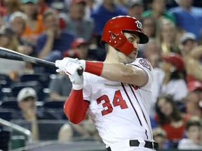 Bryce Harper of the Washington Nationals slugs an eighth-inning double against the Baltimore Orioles at Nationals Park on June 21, 2018.