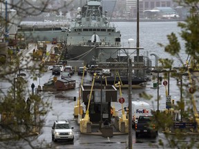 Vehicles enter Canadian Forces Base Halifax, in Halifax, on October 22, 2014, where Sgt. Kevin MacIntyre, who has been accused of sexual assault, was based.