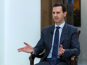 In this photo released on Sunday, June 10, 2018 by the Syrian official news agency SANA, Syrian President Bashar Assad speaks during an interview with the Daily Mail, in Damascus, Syria.