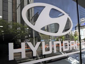 FILE - In this Wednesday, April 26, 2017, file photo, the logo of Hyundai Motor Co. is displayed at the automaker's showroom in Seoul, South Korea. Hyundai Motor Group on Wednesday says it has signed an agreement with Audi AG to jointly develop electronics vehicles powered by fuel cell.