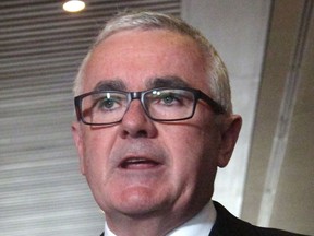 Lawmaker Andrew Wilkie addresses the media in Parliament House in Canberra, Australia, Thursday, June 28, 2018. Wilkie revealed in Parliament that lawyer Bernard Collaery and a former spy client who accused the Australian government of illegally bugging the East Timorese Cabinet have been charged with conspiring to disclose secret information.