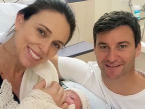 In this photo released by the Office of the Prime Minister of New Zealand, Prime Minster Jacinda Ardern and her partner Clarke Gayford pose with their newborn daughter at the Auckland City Hospital, Thursday, June 21, 2018, in Auckland, New Zealand. (Office of the Prime Minister of New Zealand via AP)