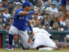 Jose Iglesias of the Tigers steals third base as Toronto Blue Jays third baseman Yangervis Solarte loses the ball in the second inning of their game in Detroit on Friday night.
