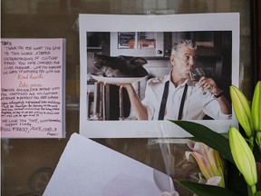 Notes, photographs and flowers are left in memory of Anthony Bourdain at the closed location of Brasserie Les Halles, where Bourdain worked as executive chef, on June 8, 2018, in New York City.