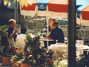 In this 1993 FBI surveillance photo, Francis "Cadillac Frank" Salemme, left, Stephen "The Rifleman" Flemmi, second from left with back to camera, and Frank Salemme Jr., behind right, are seated at The Charles Hotel in Cambridge, Mass. The trial of Francis Salemme, a geriatric former New England Mafia boss accused of killing a nightclub owner in 1993, underscores the decline of the once-powerful mob. (FBI Surveillance Photo via AP)