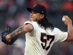 San Francisco Giants pitcher Dereck Rodriguez works against the Miami Marlins during the first inning of a baseball game Tuesday, June 19, 2018, in San Francisco.