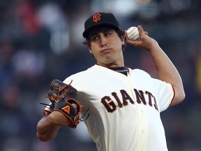 San Francisco Giants pitcher Derek Holland works against the Colorado Rockies during the first inning of a baseball game Tuesday, June 26, 2018, in San Francisco.