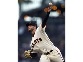 San Francisco Giants pitcher Andrew Suarez works against the Miami Marlins in the first inning of a baseball game Monday, June 18, 2018, in San Francisco.