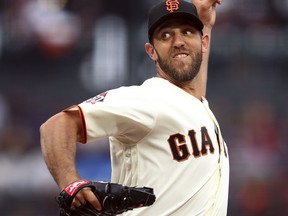 San Francisco Giants pitcher Madison Bumgarner works against the Colorado Rockies during the first inning of a baseball game Wednesday, June 27, 2018, in San Francisco.