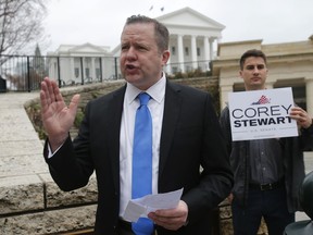 FILE - In this Feb. 22, 2018 file photo, Virginia GOP senatorial hopeful, Corey Stewart, gestures during a news conference at the Capitol in Richmond, Va. Stewart, a conservative provocateur and supporter of President Donald Trump won Virginia's Republican primary Tuesday, June 12, 2018, in the U.S. Senate race, and he has promised to run a "vicious" campaign against incumbent Tim Kaine.