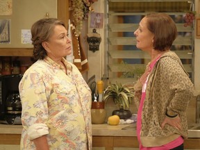 In this image released by ABC, Roseanne Barr, left, and Laurie Metcalf appear in a scene from the reboot of the popular comedy series "Roseanne." ABC, which canceled its "Roseanne" revival over its star's racist tweet, said Thursday, June 21, 2018, it will air a Conner family sitcom minus Roseanne Barr this fall.