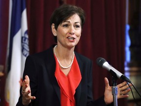 FILE - In this May 25, 2017, file photo, Iowa Gov. Kim Reynolds speaks during a news conference at the Statehouse in Des Moines, Iowa. Reynolds signed into law Wednesday, May 30, 2018, state tax cuts of $2.8 billion over six years, touting the benefits for the middle class. Most changes in personal income tax rates go into effect in tax year 2019, including lower rates for all income brackets.