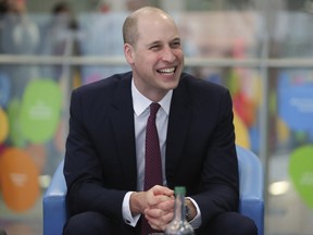 FILE - In this Jan. 18, 2018 file photo, Britain's Prince William, laughs while with military veterans now working for the National Health Service as he visits Evelina London Children's Hospital in London. Prince William is set to arrive in Israel and the Palestinian territories,  for the first official visit of a member of the British royal family, ending the monarchy's decades-long mostly hands-off approach to one of the world's most sensitive spots. The prince kicks off his Middle East visit Sunday, June 24  in Jordan, before arriving in Jerusalem on Monday.