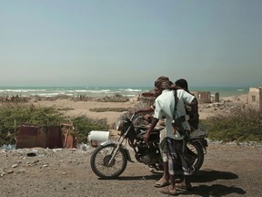 FILE - In this Feb. 12, 2018 file photo, Saudi-backed forces, part of Ahmed al-Kawkabani's, southern resistance unit in Hodeida, patrol in Hodeida, Yemen. The Saudi-led coalition backing Yemen's exiled government began an assault Wednesday, June 13, 2018 on the port city of Hodeida, the main entry point for food in a country already teetering on the brink of famine.