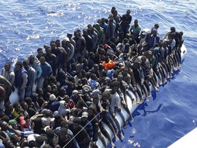 This Sunday, June 24, 2018 photo released by the Libyan Coast Guard shows migrants on a ship intercepted offshore near the town of Gohneima, east of the capital, Tripoli. There were four boats, boarding 490 African migrants including 75 women and 21 children, Spokesman Ayoub Gassim said. (Libyan Coast Guard via AP)